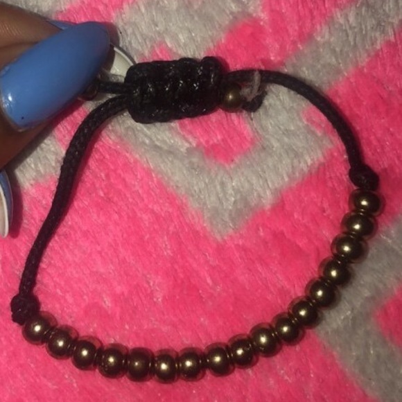 Two gold and black bracelets - Picture 2 of 2